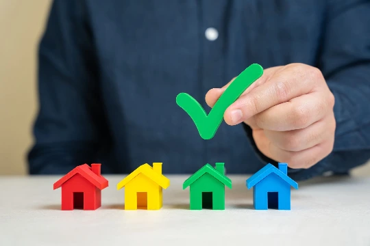 Person comparing mortgage documents and loan options